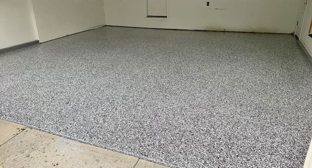 Epoxy-coated garage floor with gray speckled finish