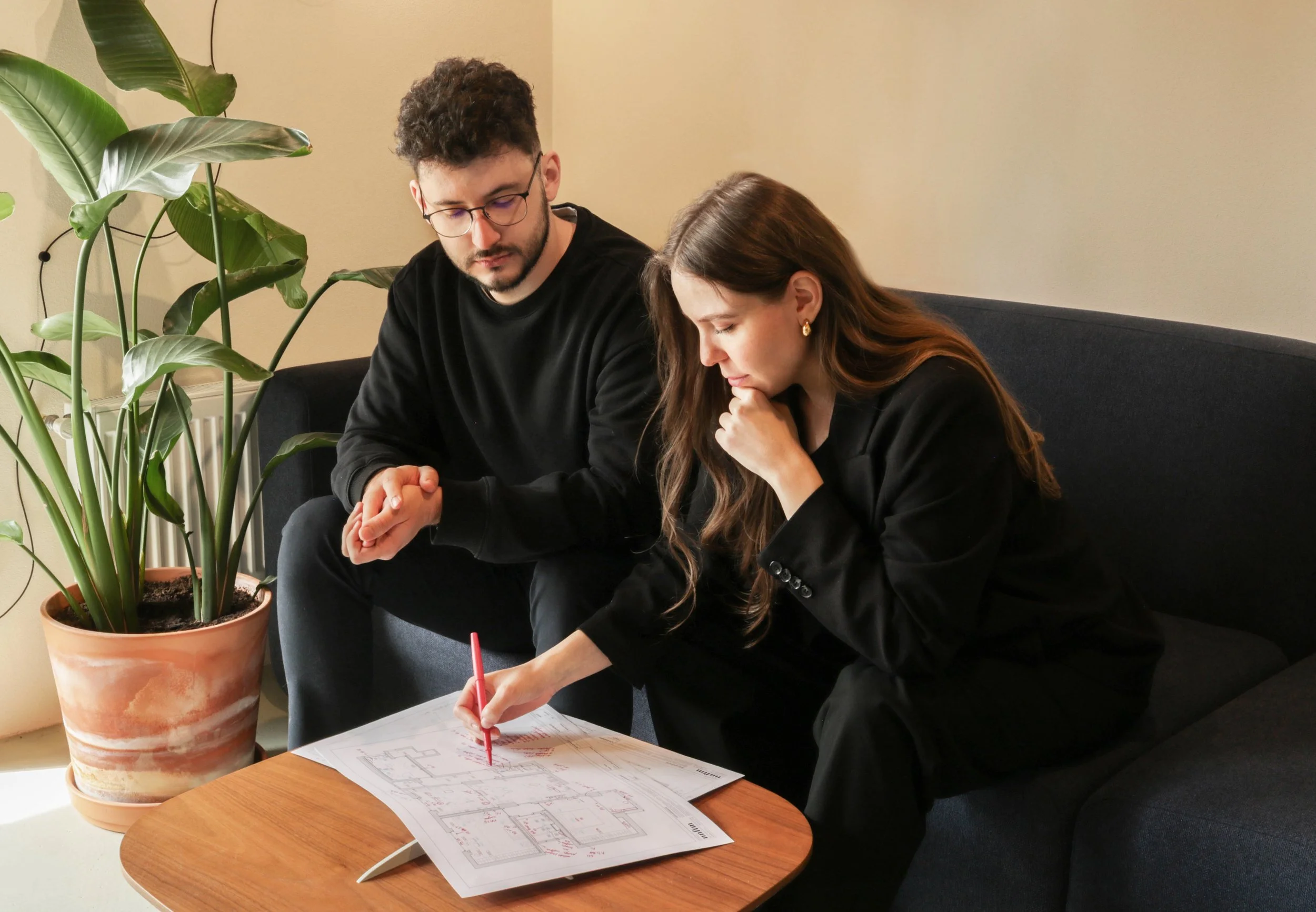 NNFTM architecture and interior design team collaborating in a modern studio workspace