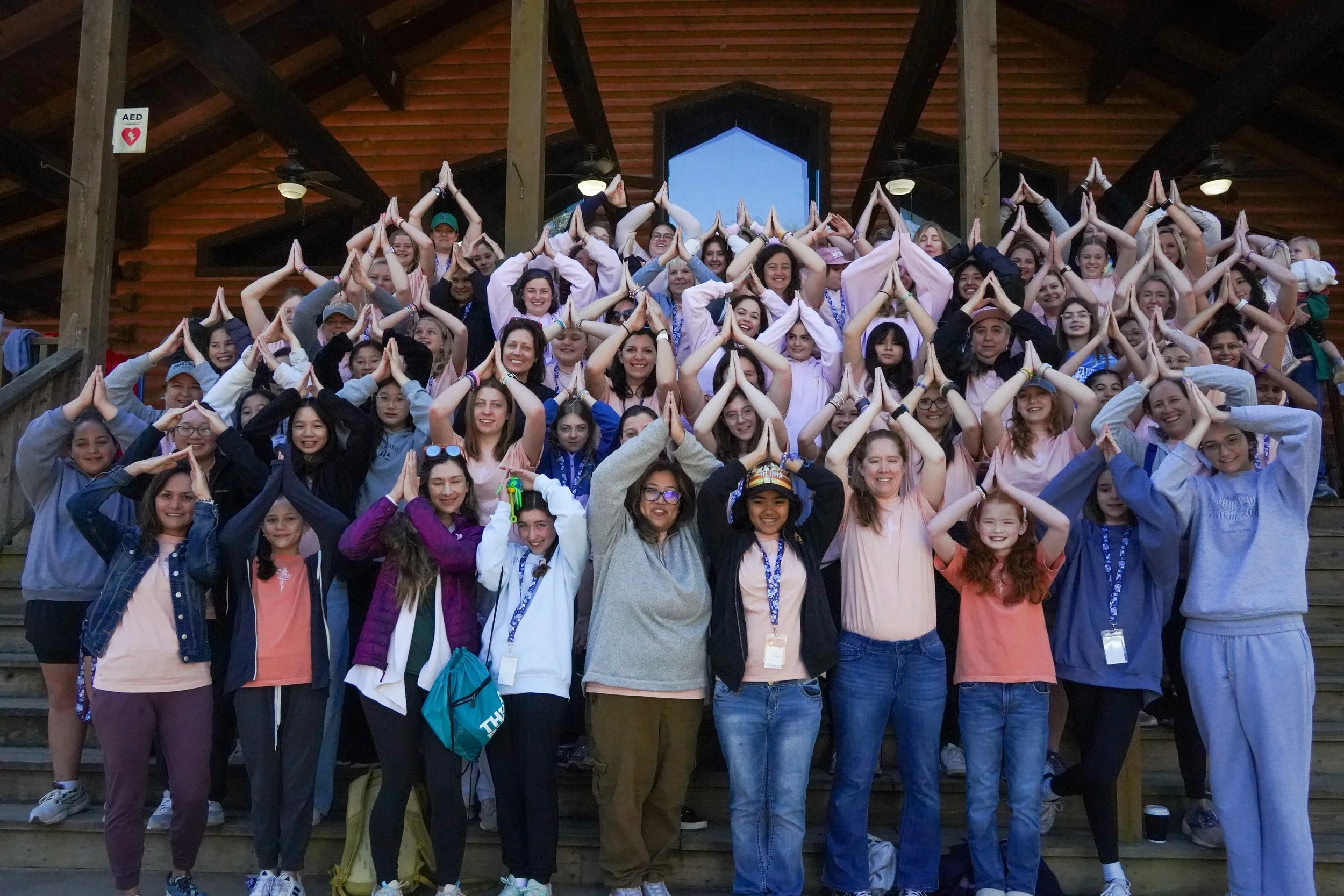 Mother and daughters at climbing wall