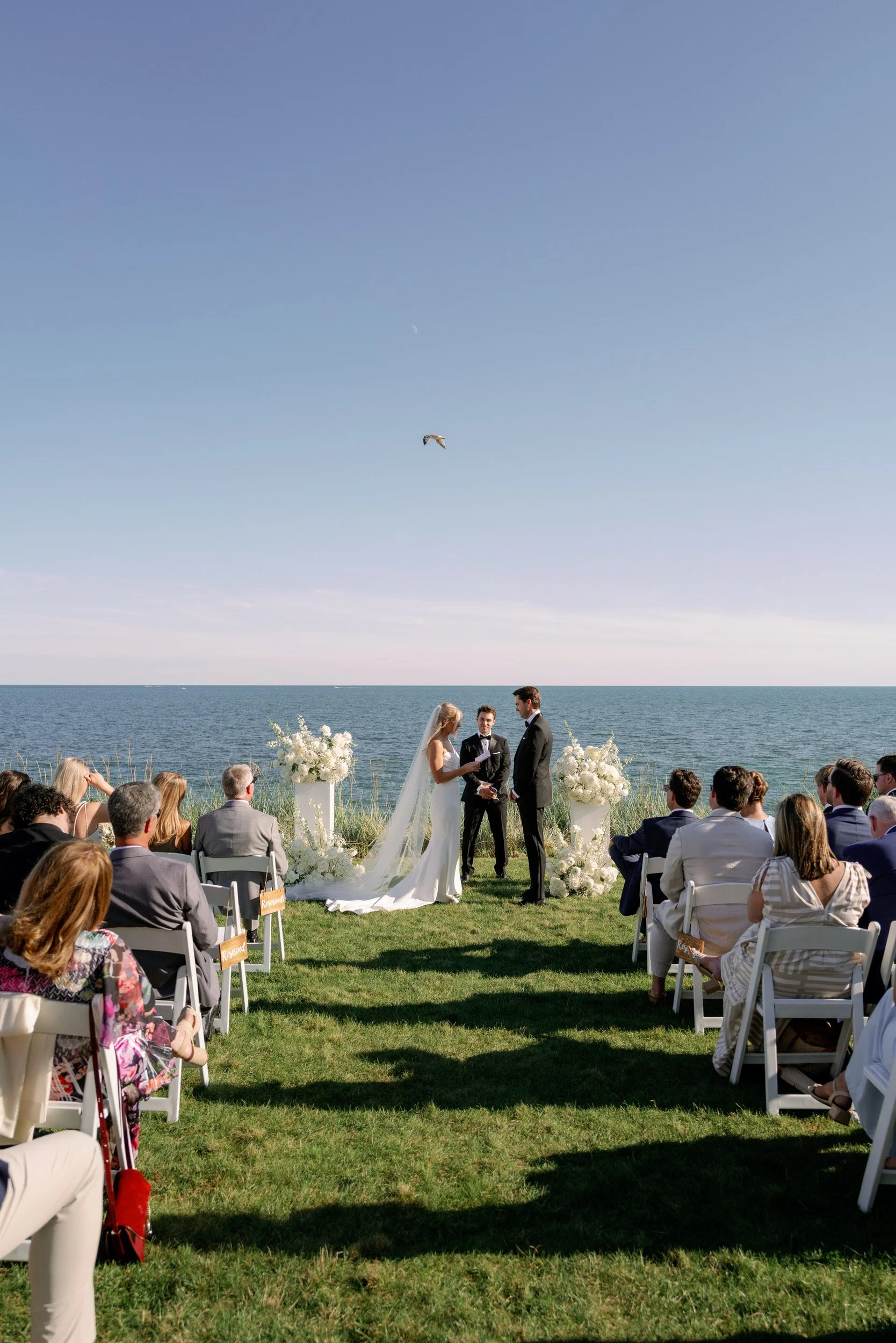 Newlyweds exchanging vows seen from down the aisle 