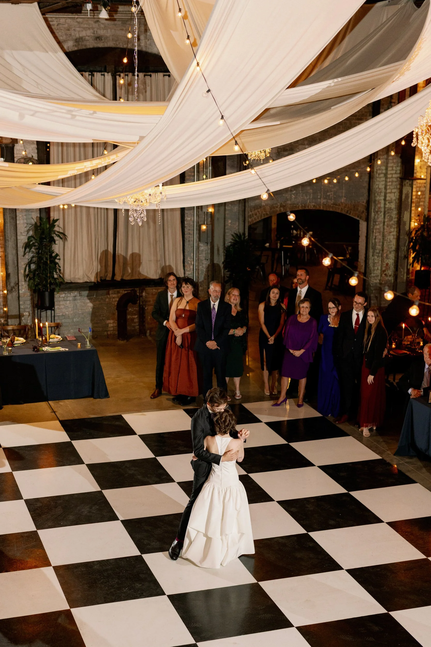 A newlywed couple during their first dance at their wedding reception 