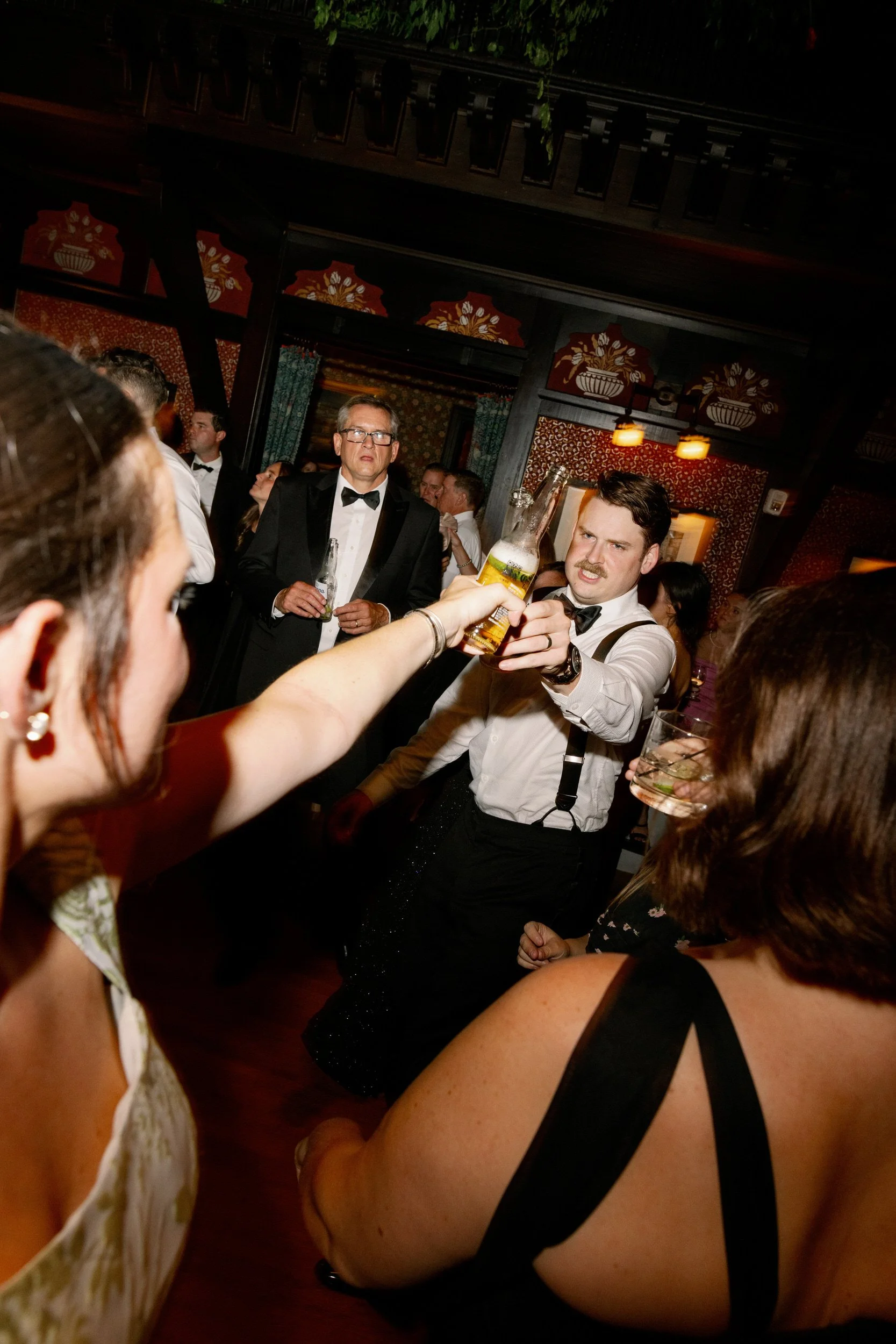Newlyweds dancing with their wedding guests during their ceremony 