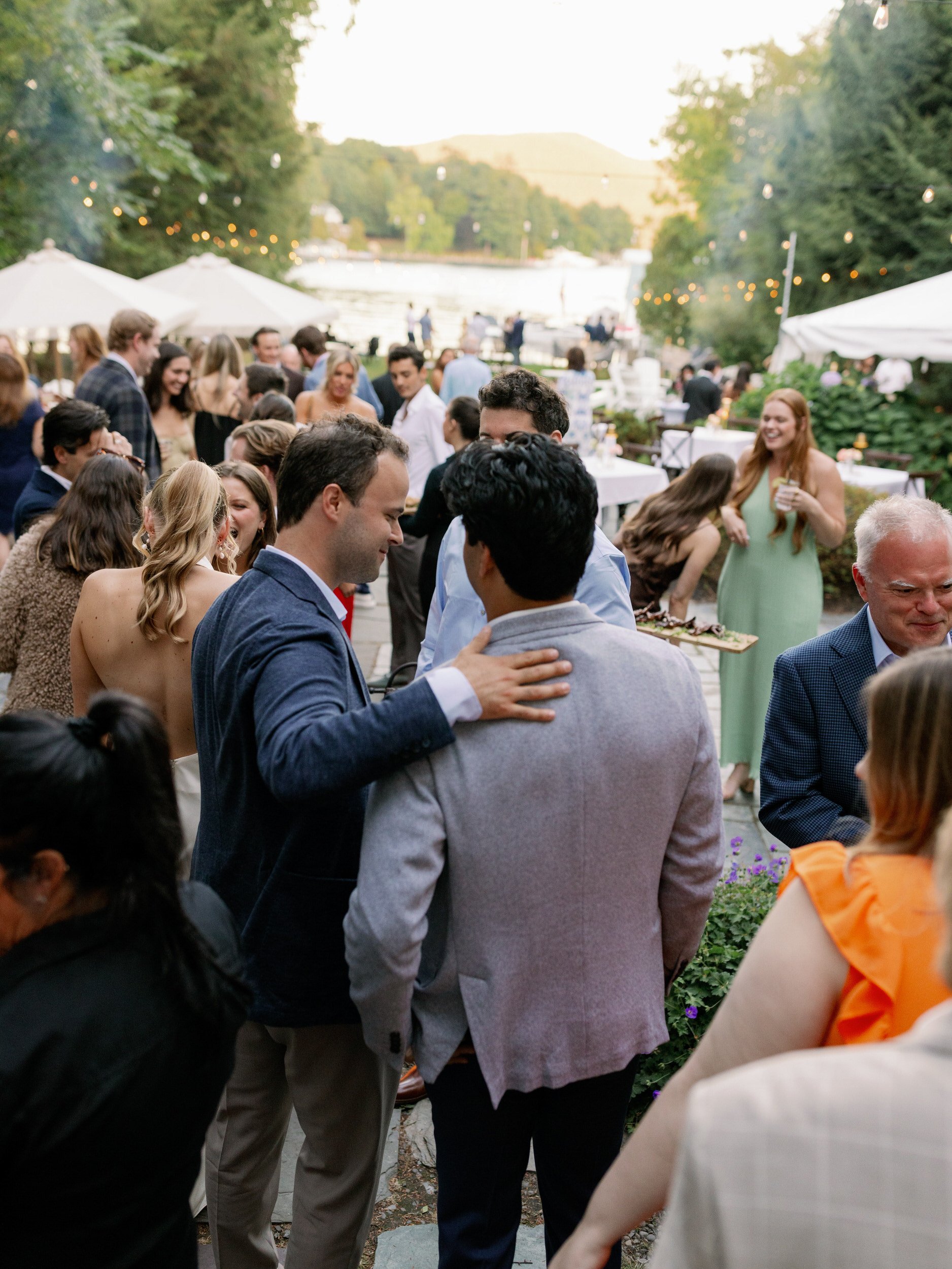 Wedding guests mingling at a reception 