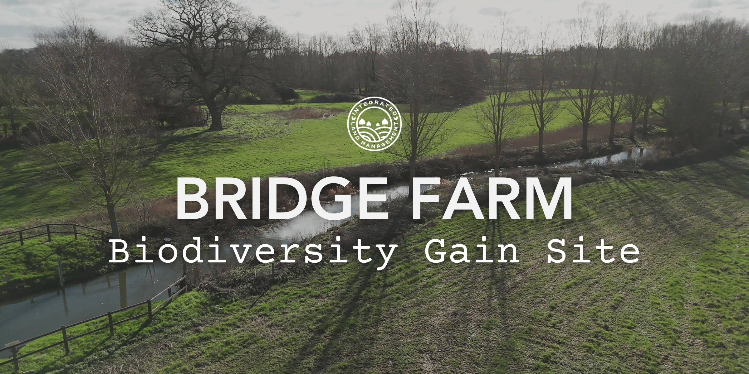 Bridge Farm Biodiversity Gain Site hero image showing agricultural and woodland land with a small river in East Suffolk, located within the South Norfolk and High Suffolk Claylands National Character Area.