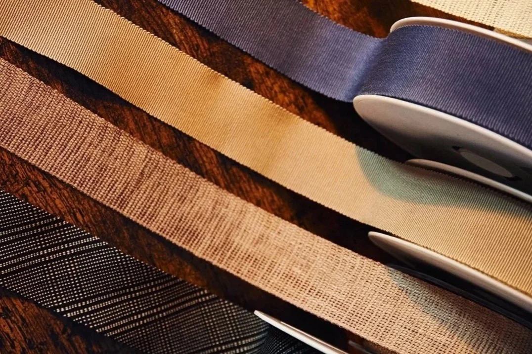 Selection of fabric ribbons used for hat trims and finishing details.