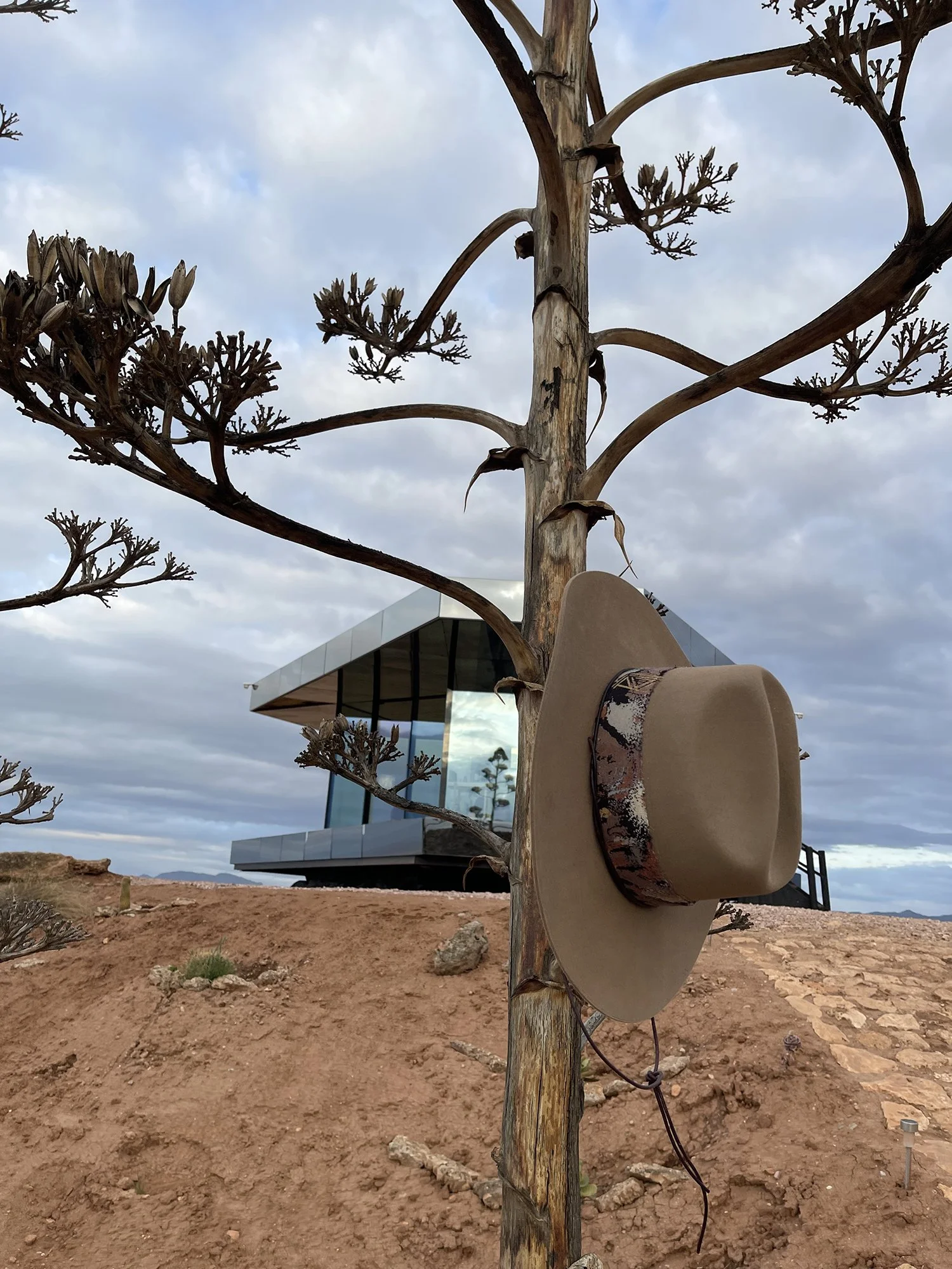 Close-up of a beige handmade felt hat.