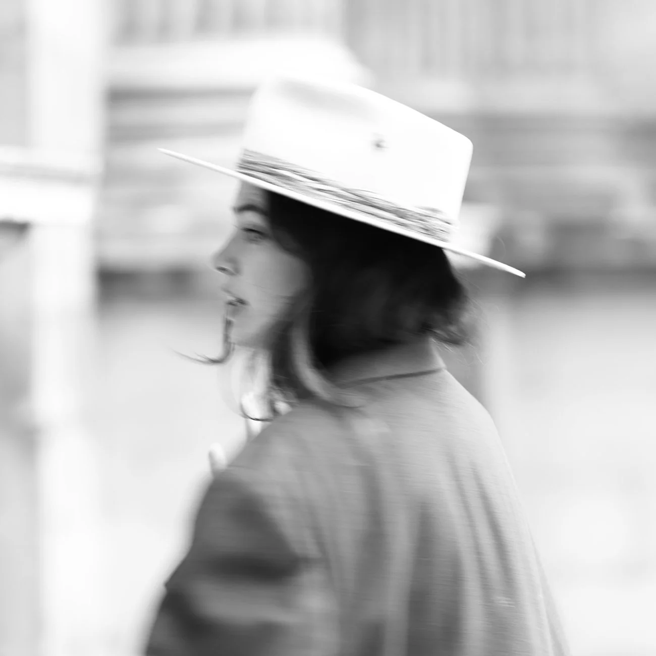 Profile portrait of a woman wearing a large handmade felt hat.
