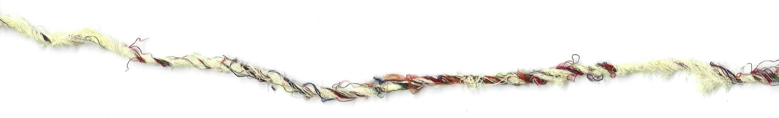 A tangled, multicolored string of yarn or thread on a white background.