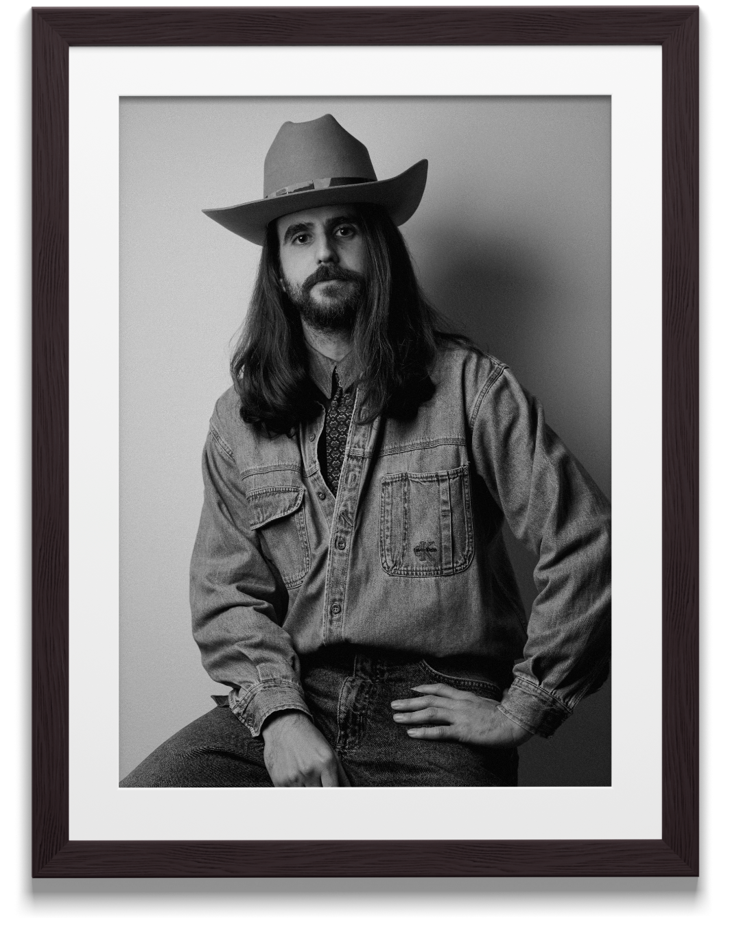 Black and white portrait of a man wearing a handmade cowboy-style felt hat.