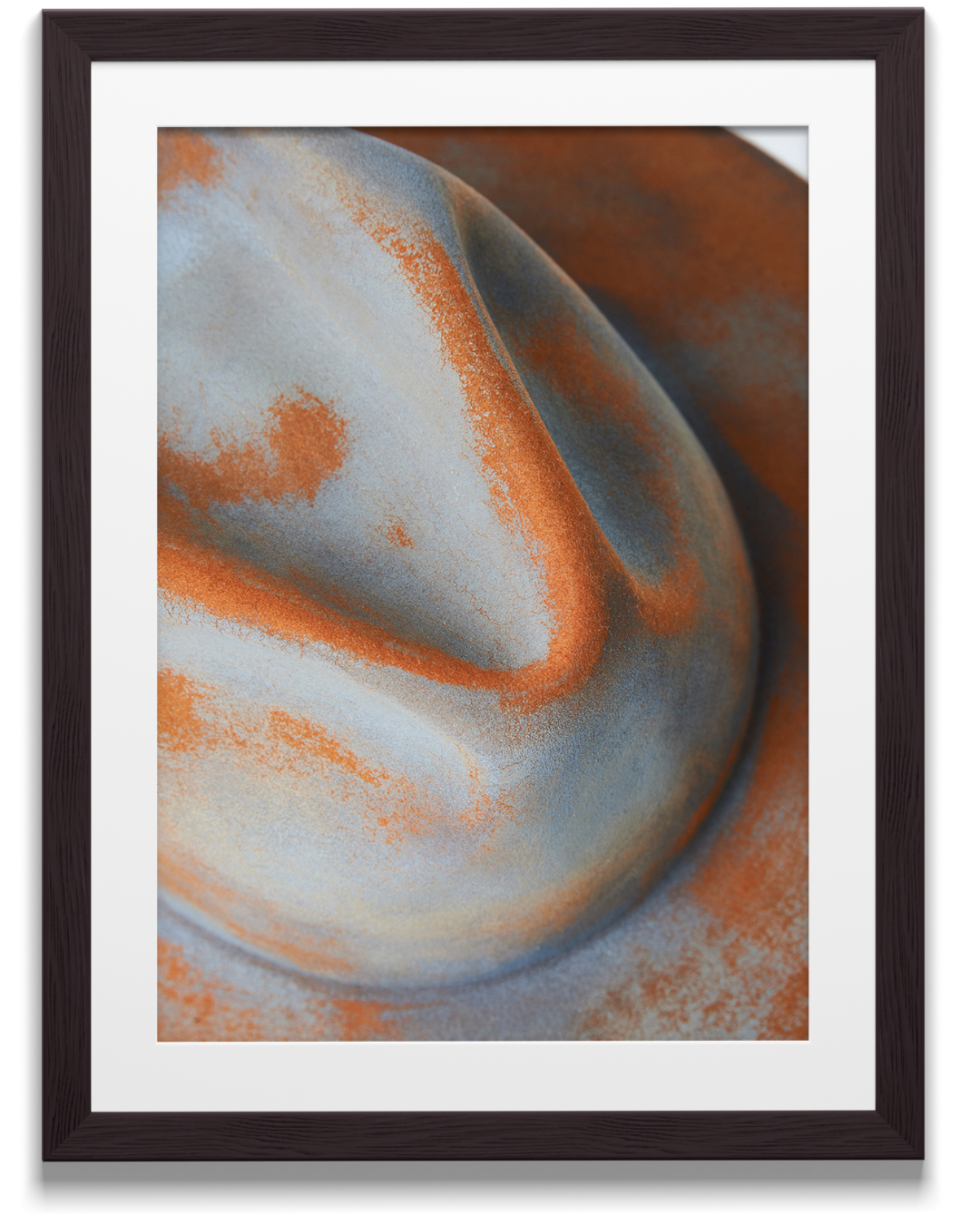 Close-up of a rusted, textured, weathered metallic surface with shades of orange, gray, and blue.