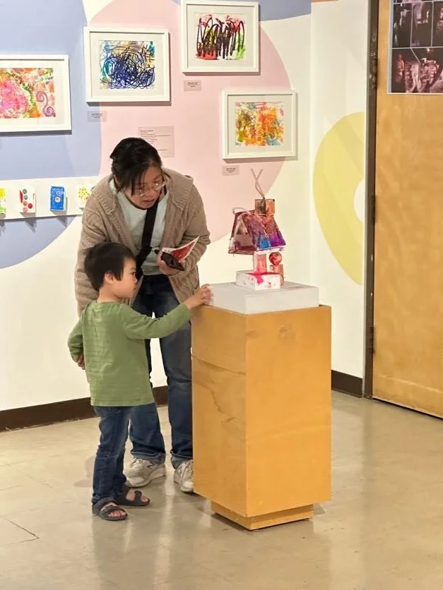 Studio artist and family with Styrofoam Sculpture