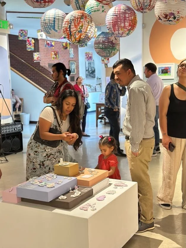 Studio artist and family with Clay Creations