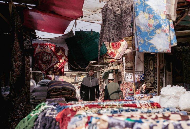 A Kyrgyz market stall full of colourful textiles