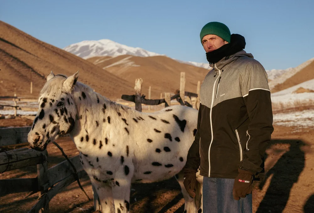 Léon Mitouard, one of the first winter volunteers at Chaar Ranch, with a spotted Chaar horse. Photo: Salomé Guilleme