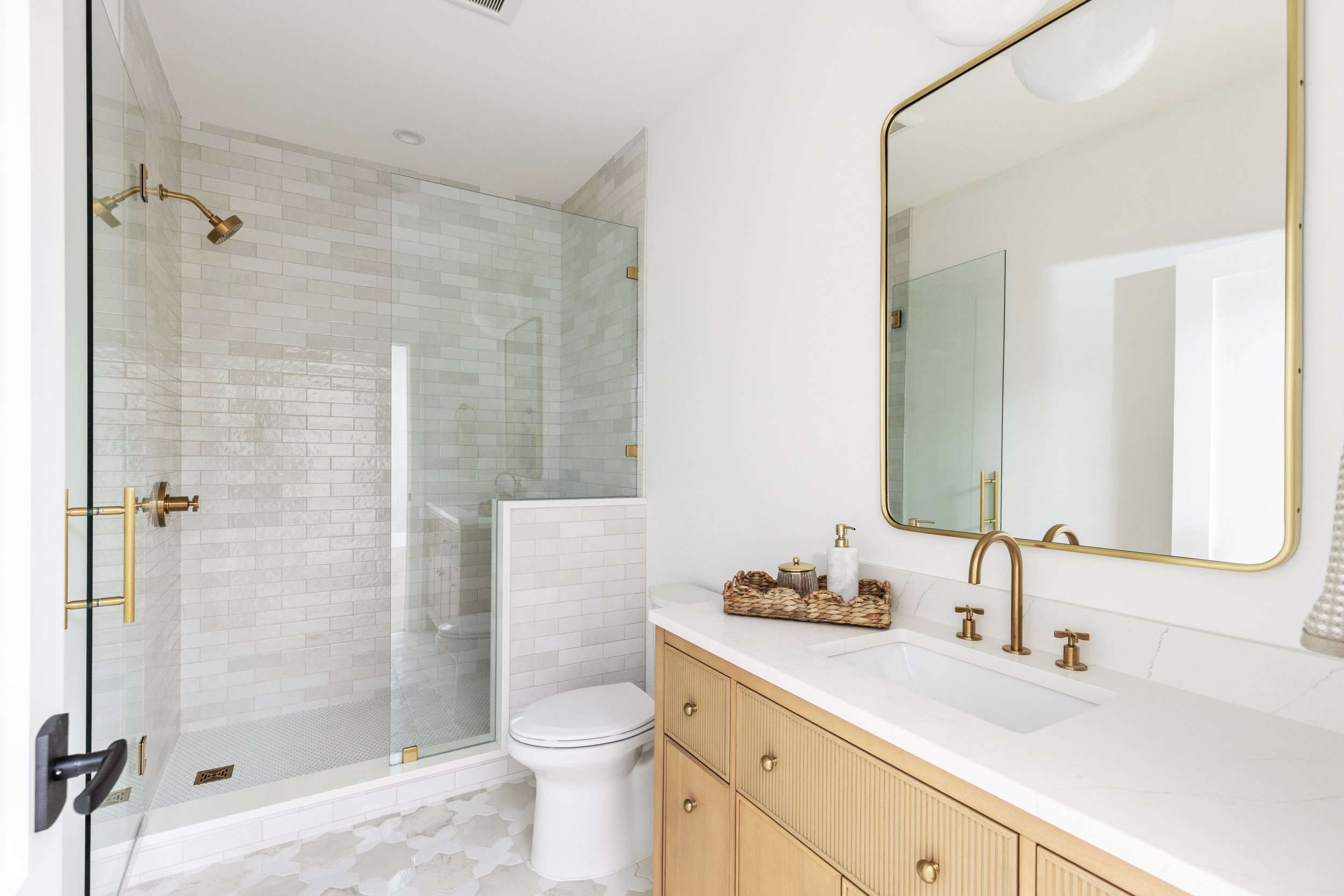 guest bathroom design with studio mcgee vanity and brass accents