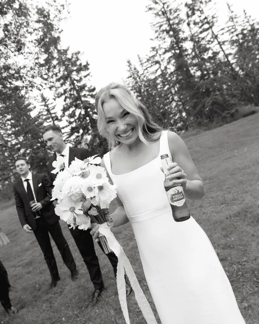 The joy in these photos has us so incredibly giddy.

Laura came in and said that she wanted her day to feel very relaxed, go with the flow, an easy-going experience for her guests, and a dress that felt the exact same way. Here she is on her day, and