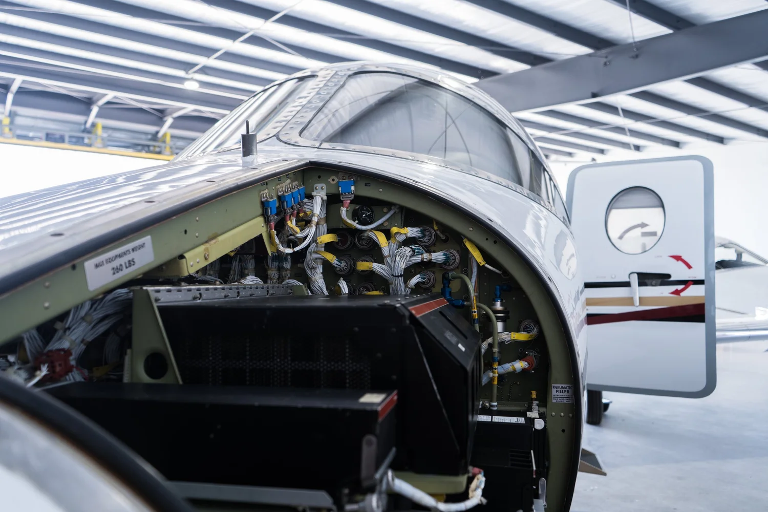 Nose avionics bay open during an inspection