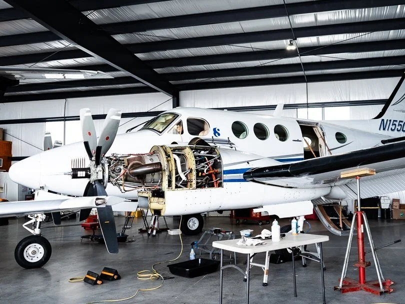 Beechcraft King Air in the hangar with a PT6A engine opened up