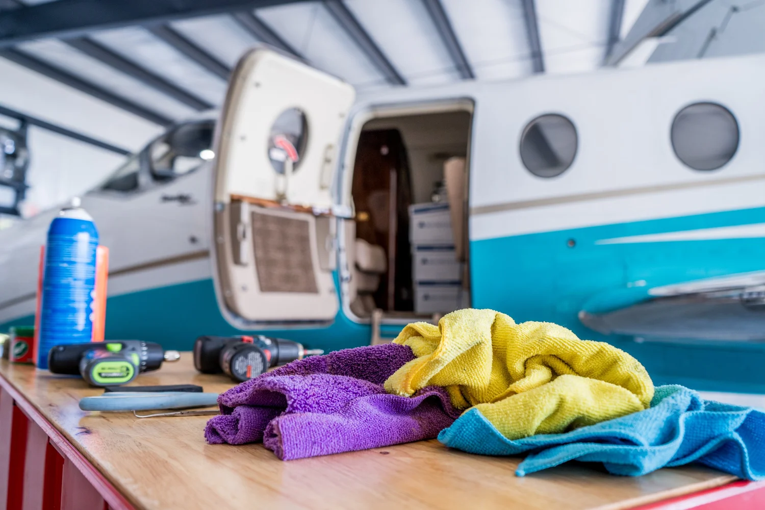 Tools and shop towels beside an open cabin door