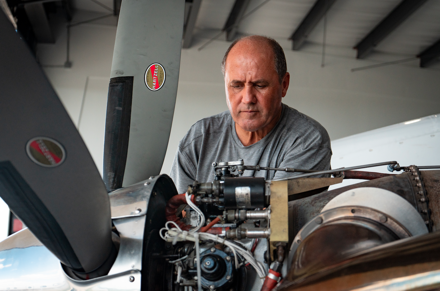 Working on a PT6A turboprop engine behind the propeller