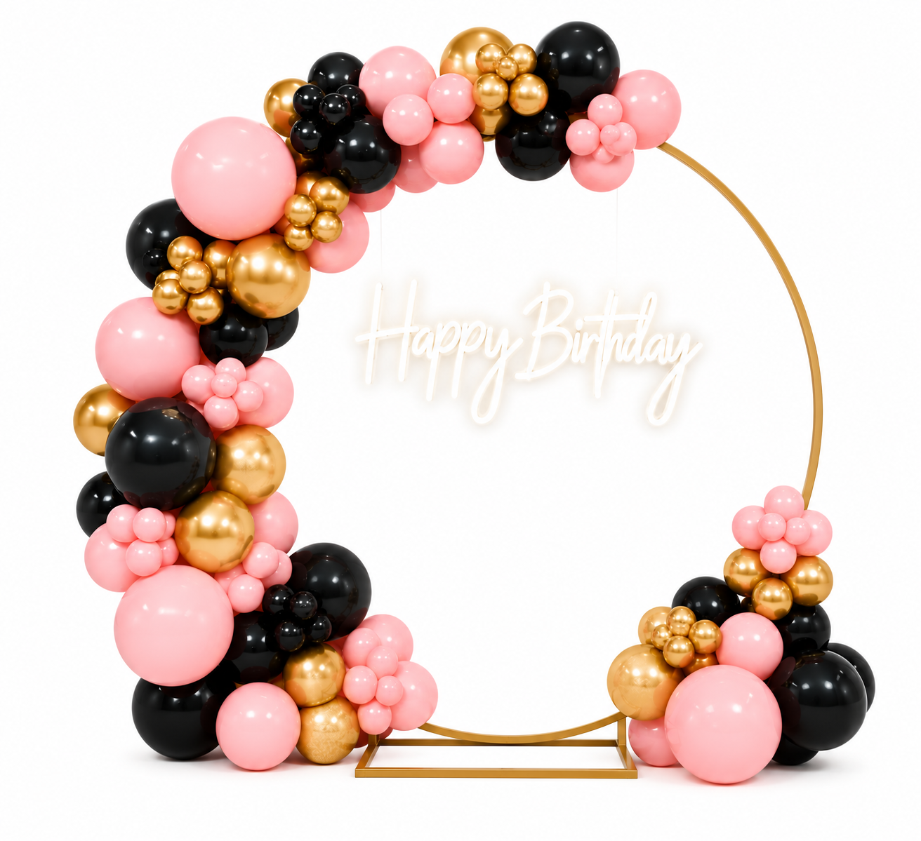 Balloon arrangement with pink, black, and gold balloons framing a white circular stand with a neon sign that reads 'Happy Birthday' in cursive.