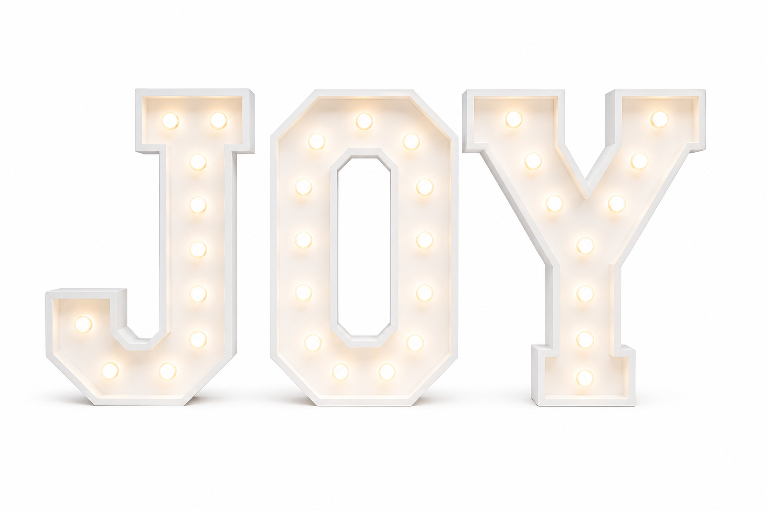 Illuminated marquee sign spelling out the word 'JOY' with white frame and warm white lights on a white background.