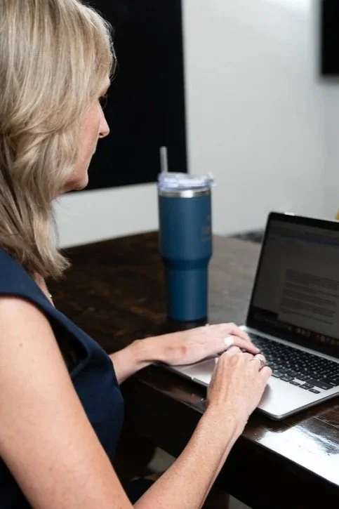 woman typing on computer