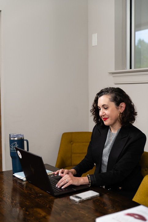 woman typing on computer