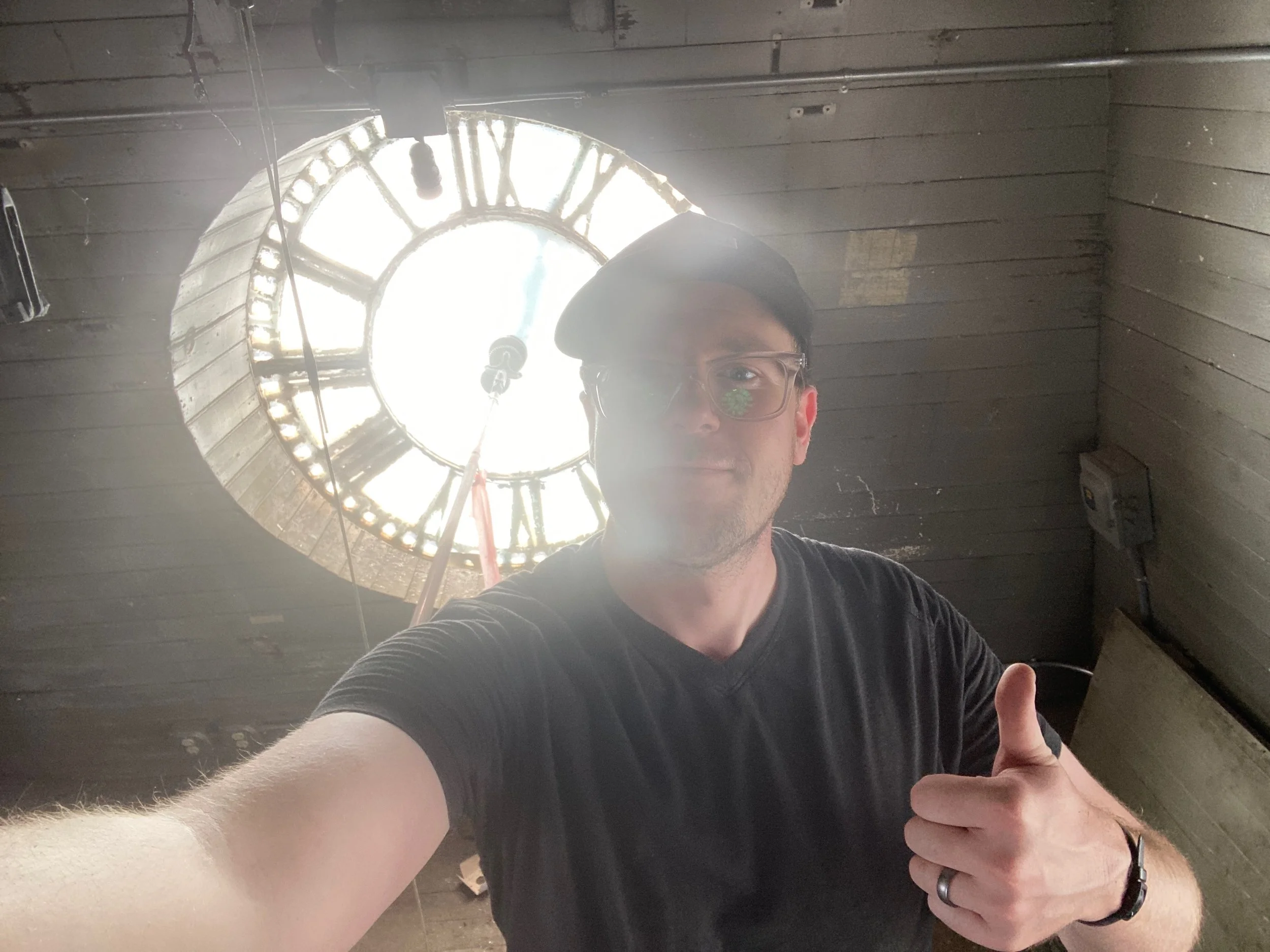A quick selfie behind the face of the clocktower. 