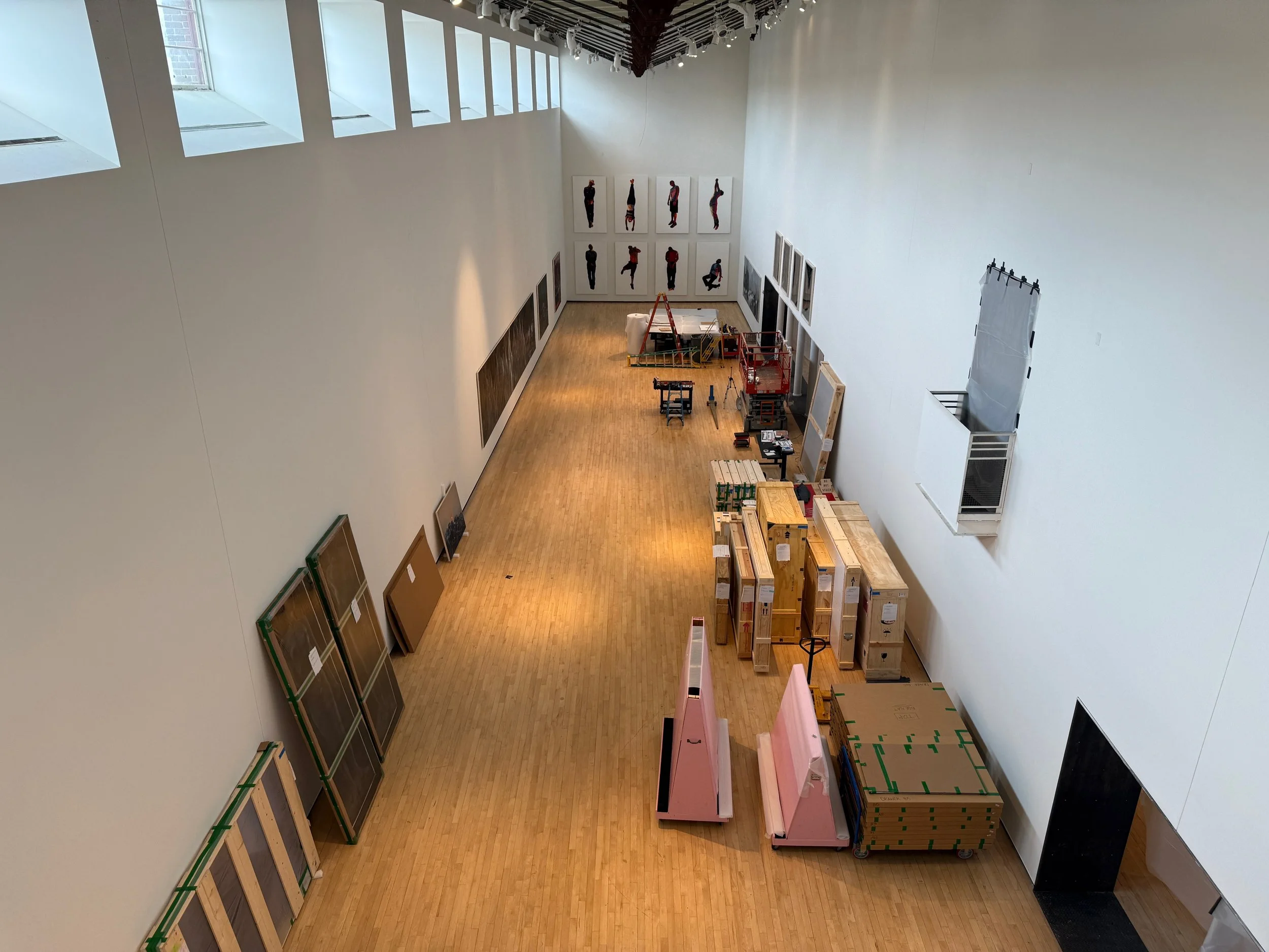 A bird's eye view of the installation process for Vincent Valdez's exhibition Just a Dream