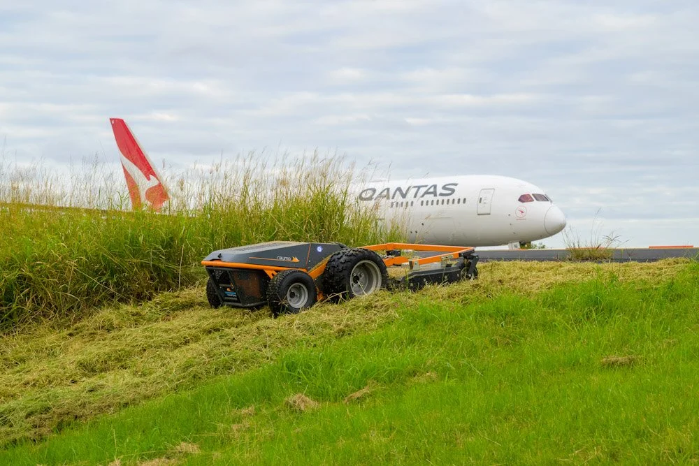 Raymo Electric Mower cutting grass at Sydney Airport