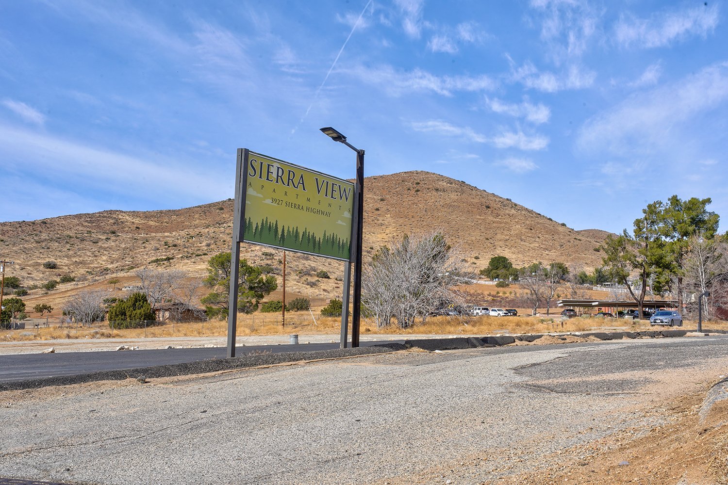 This image includes an exterior view of the complex with a Sierra View sign.