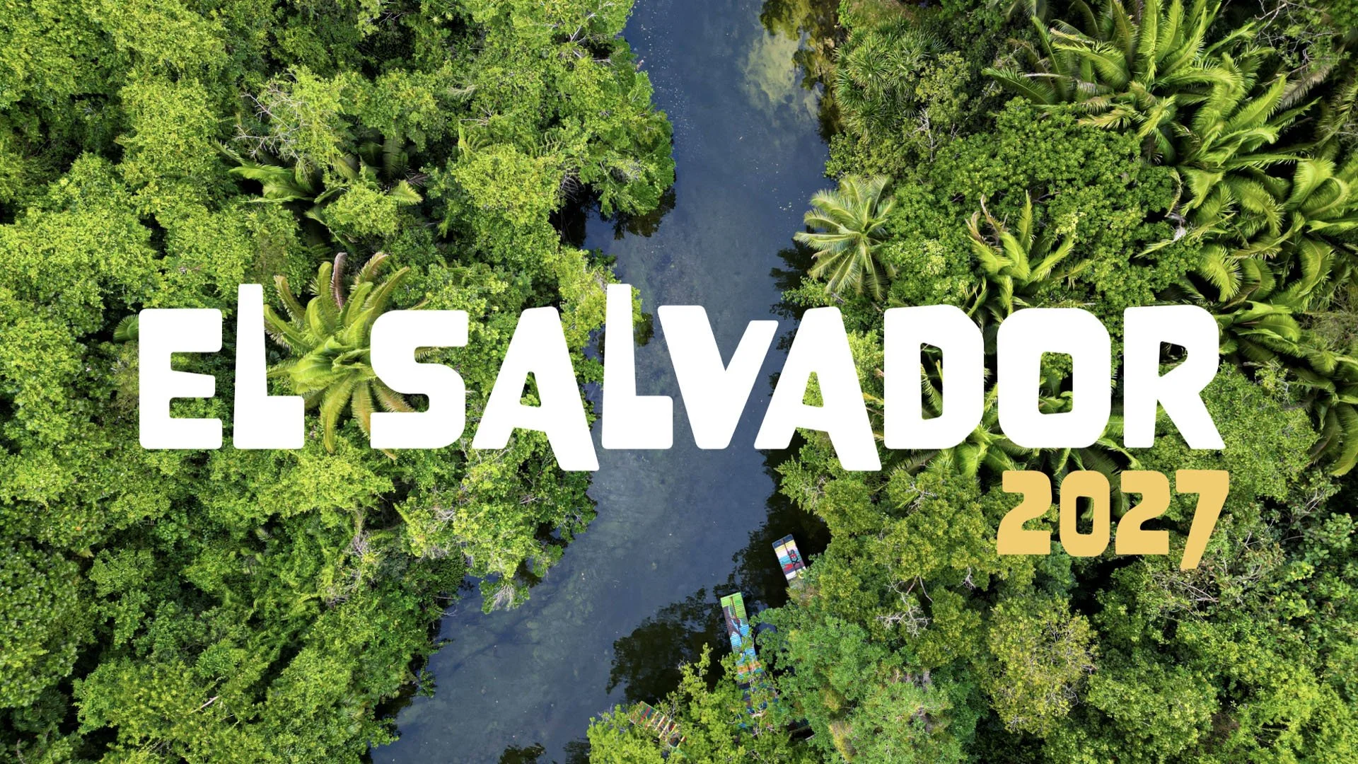 Aerial view of a lush green river surrounded by dense tropical rainforest with text overlay reading "El Salvador 2027" in large white and gold letters.