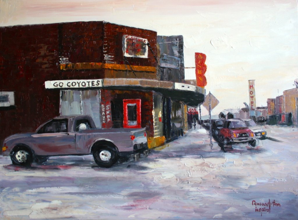 A painting of a street corner with a building that has a sign saying 'Go Coyotes.' Several parked cars are in front of and along the street, with a motel sign visible in the background.