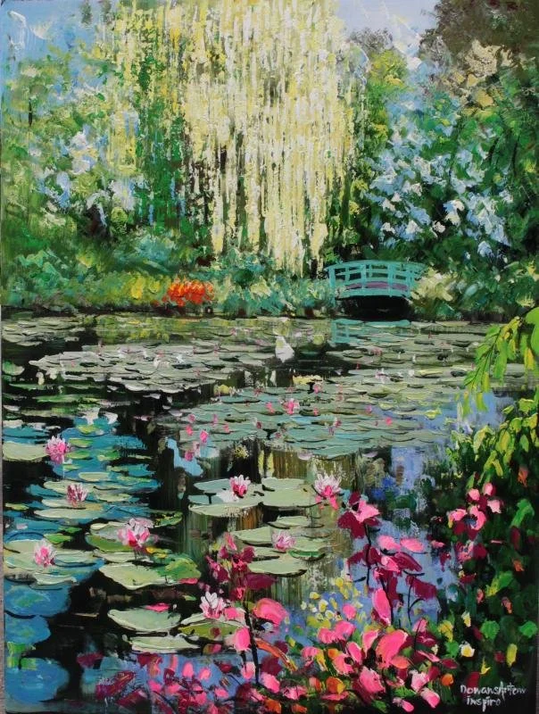 A vibrant watercolor painting of a pond with blooming pink water lilies, surrounded by lush green trees and bushes, with a small blue bridge in the background.