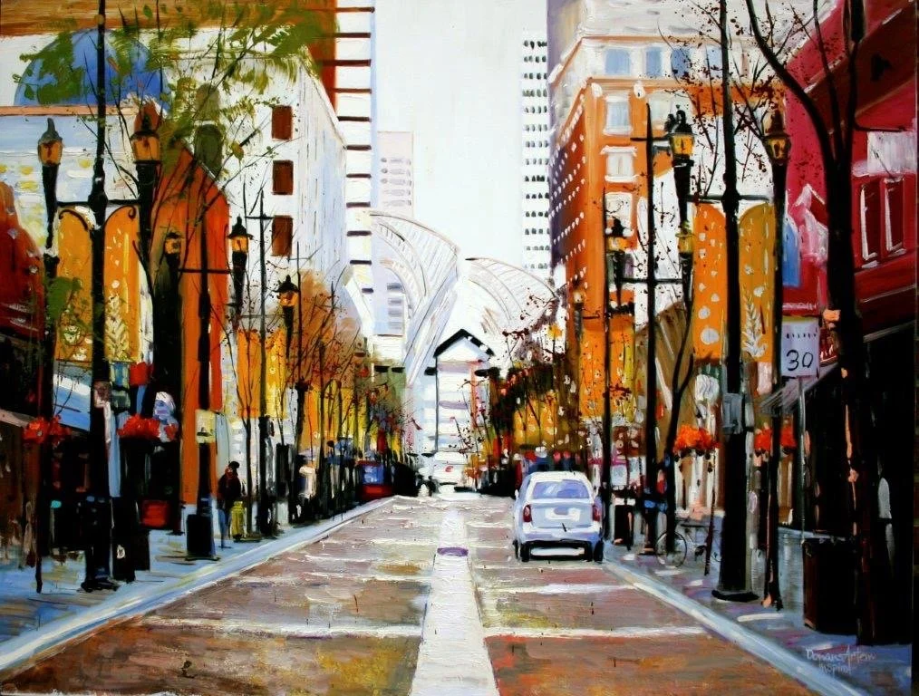 Painted digital scene of a city street with buildings, trees, and street lamps, showing cars and pedestrians.