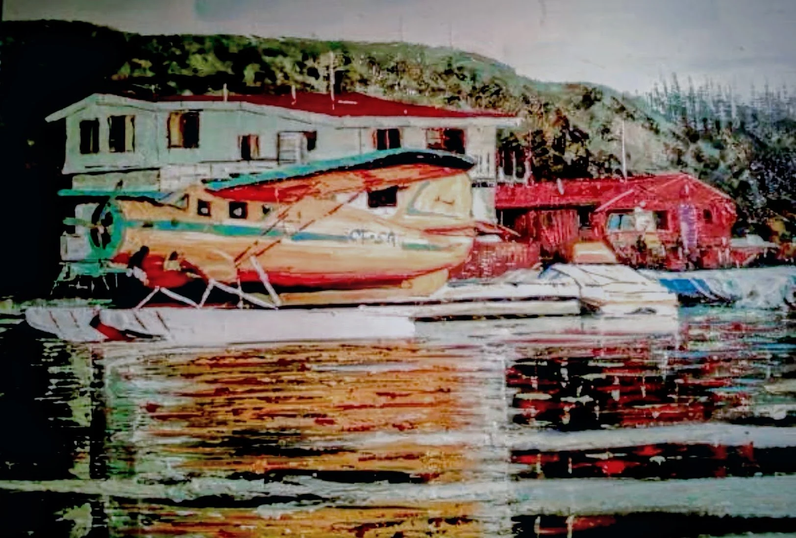 Colorful painted boat docked near houses on a hillside by the water.