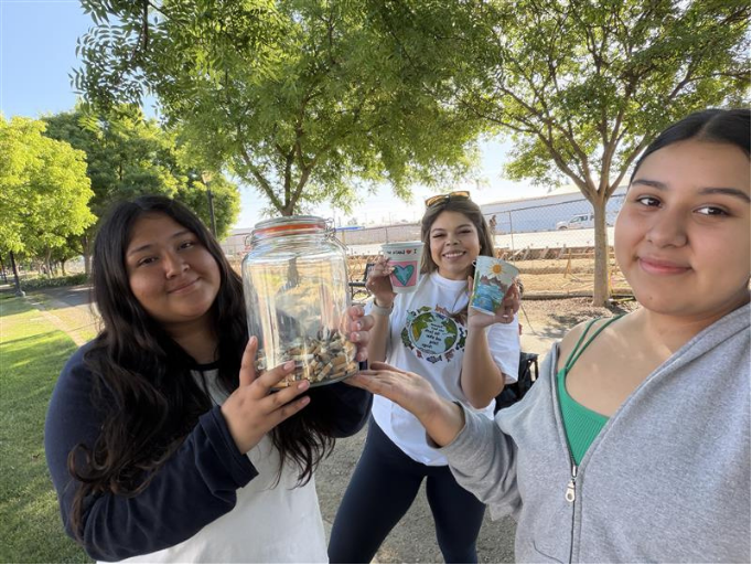 Students at an outreach table getting flyers