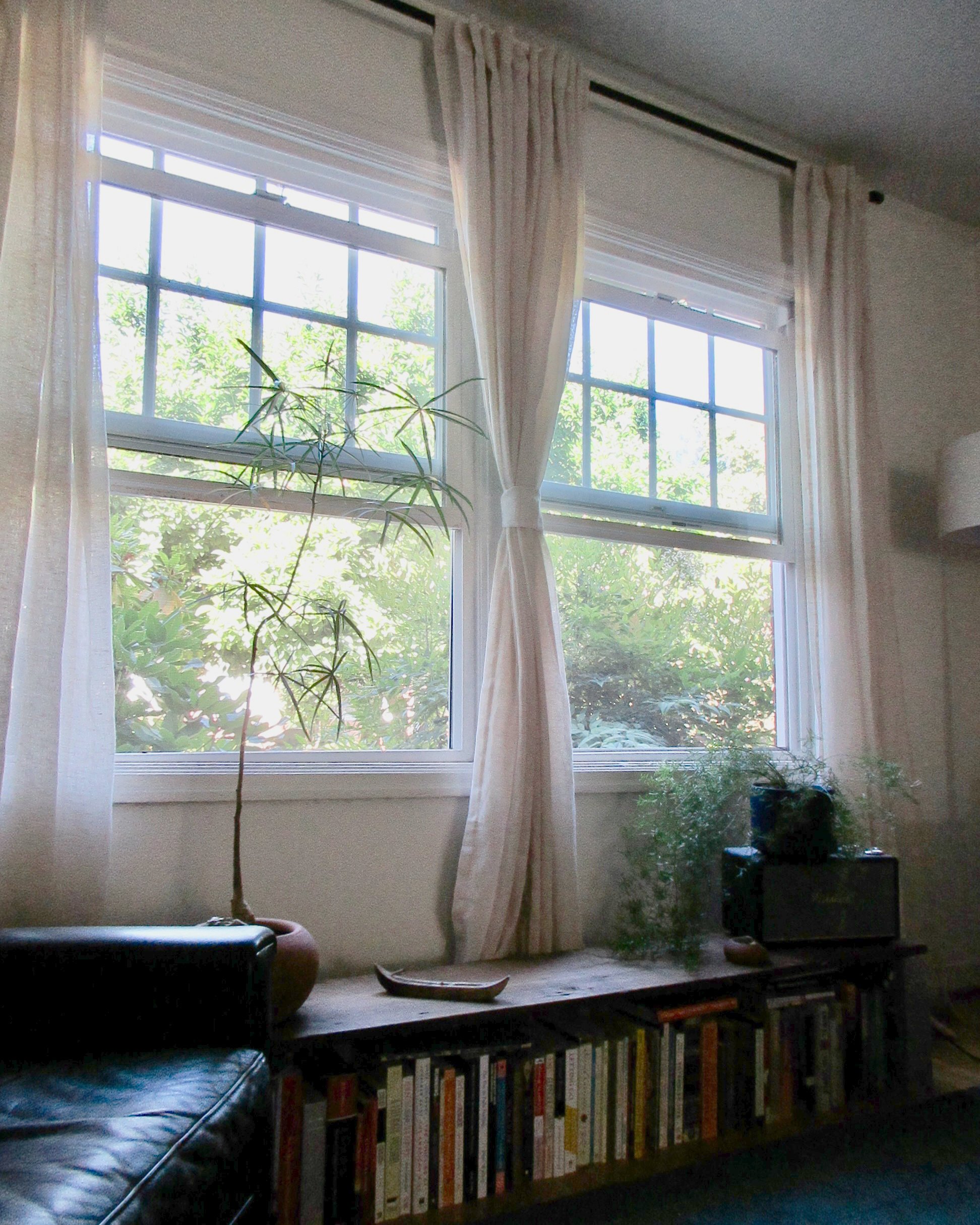 books still waiting to be read wait on the other side, mixed in with some special ones whose pages have already met sadie’s eyes. all of her curtains are so romantic. paired with the natural light from these windows, the space feels calm and peaceful