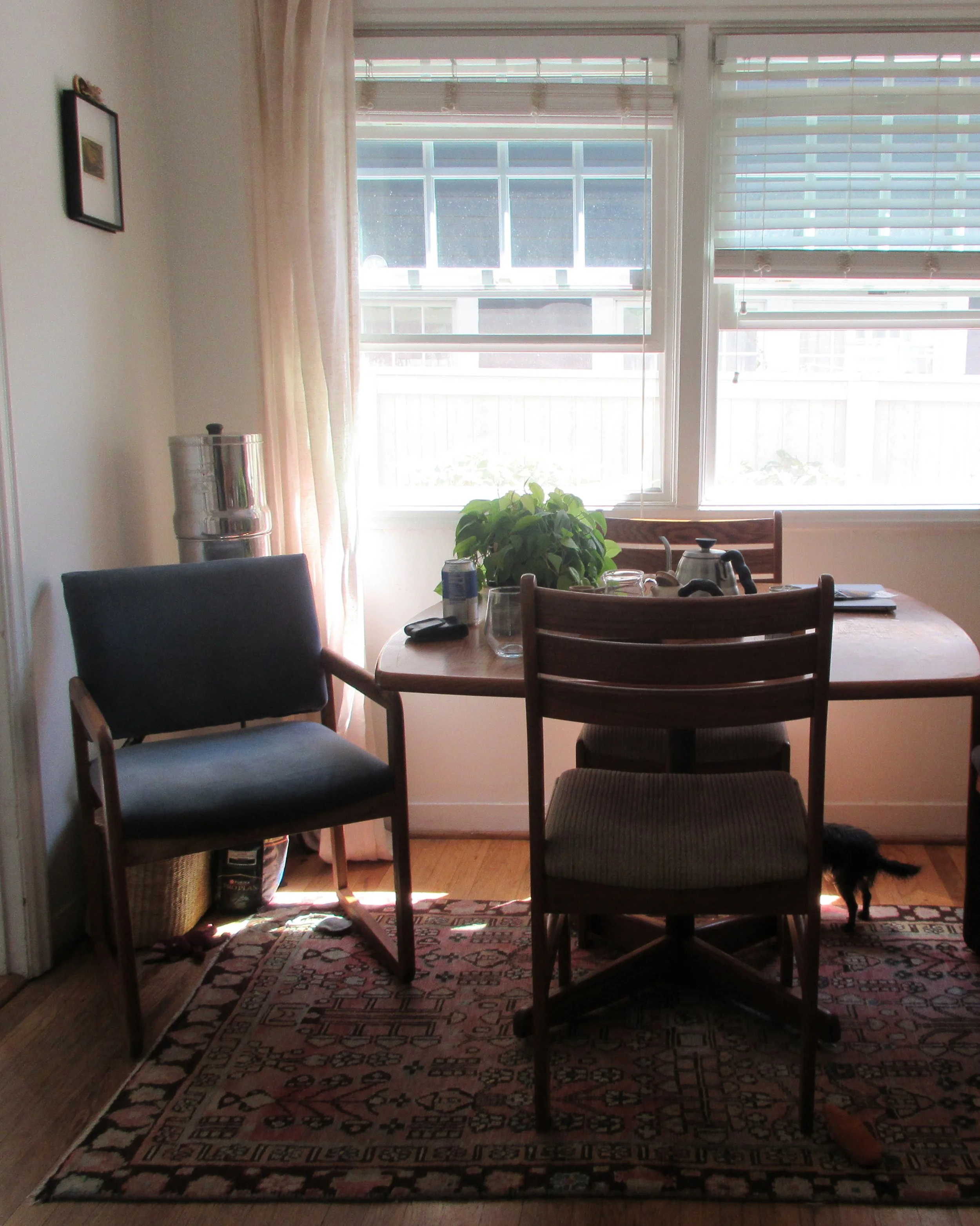 a slice of sadie’s dining table. two out of three chairs are shown; i chose the two we sat in to have tea when i arrived.