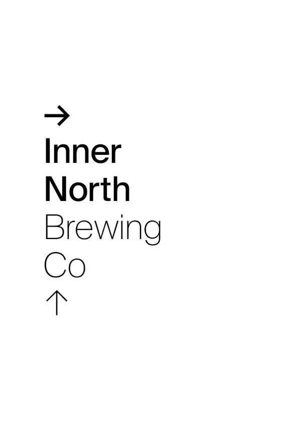 Sign for Inner North Brewing Co., with black arrows pointing right and up, on a white background.