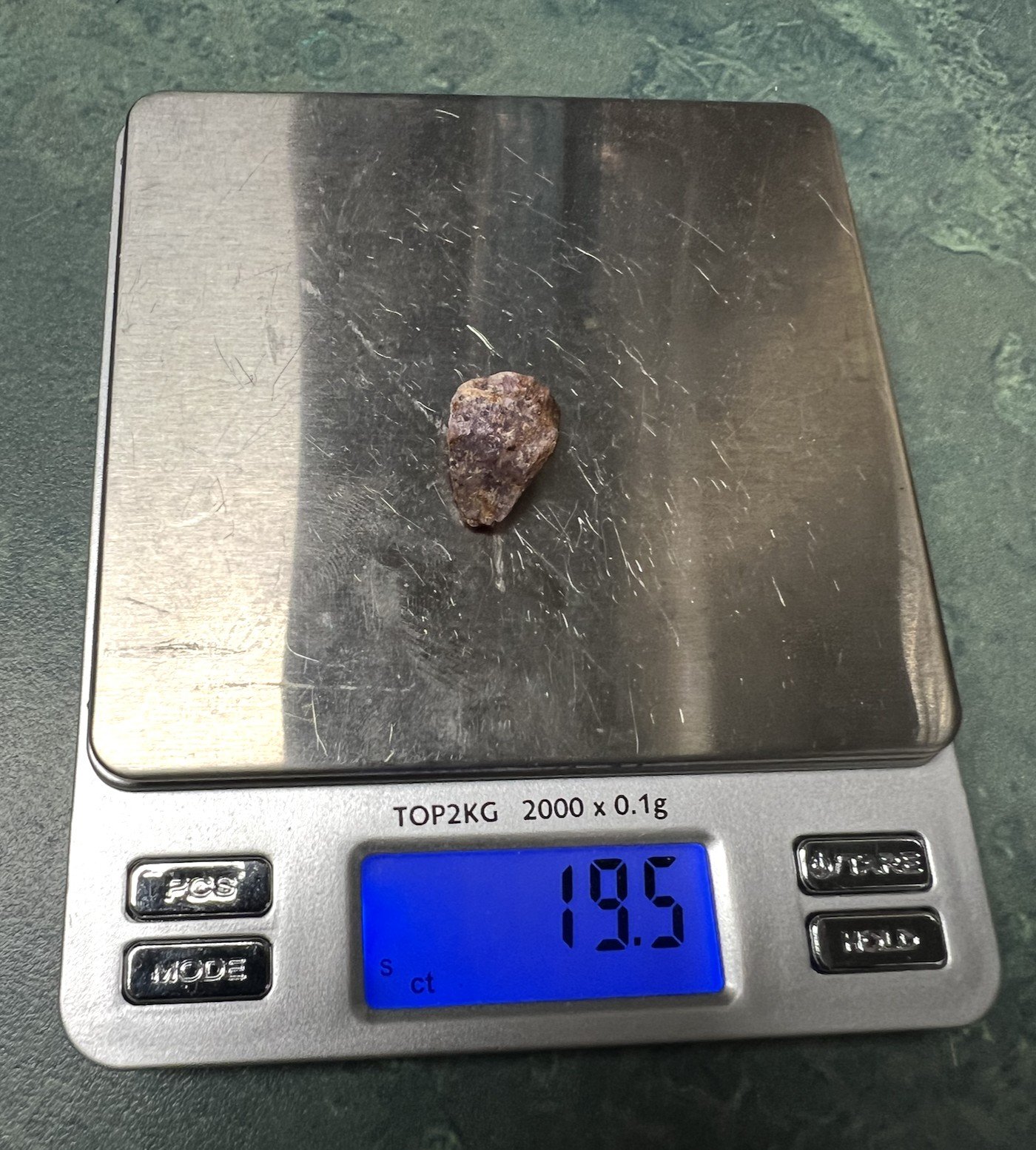 Here is the first of the two large stones from above, weighing in at 19.5 carats.