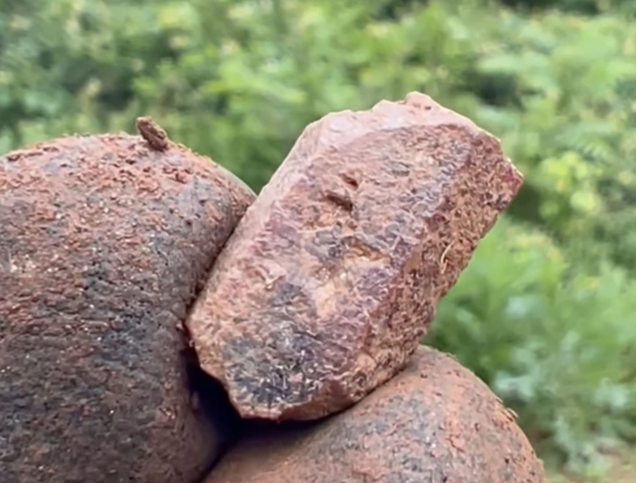 A close up.  When fully cleaned, it looked to have a blue center and red outer layer.  I loosely call it a sapphire.
