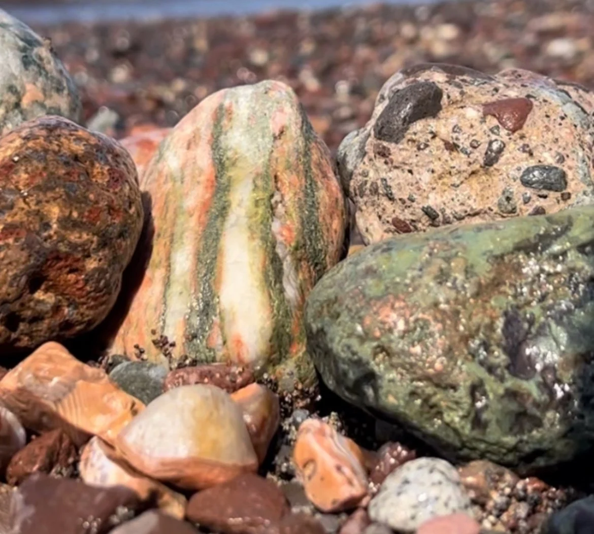 Unakite (center), water-worn concrete (back right), and native copper (front right)