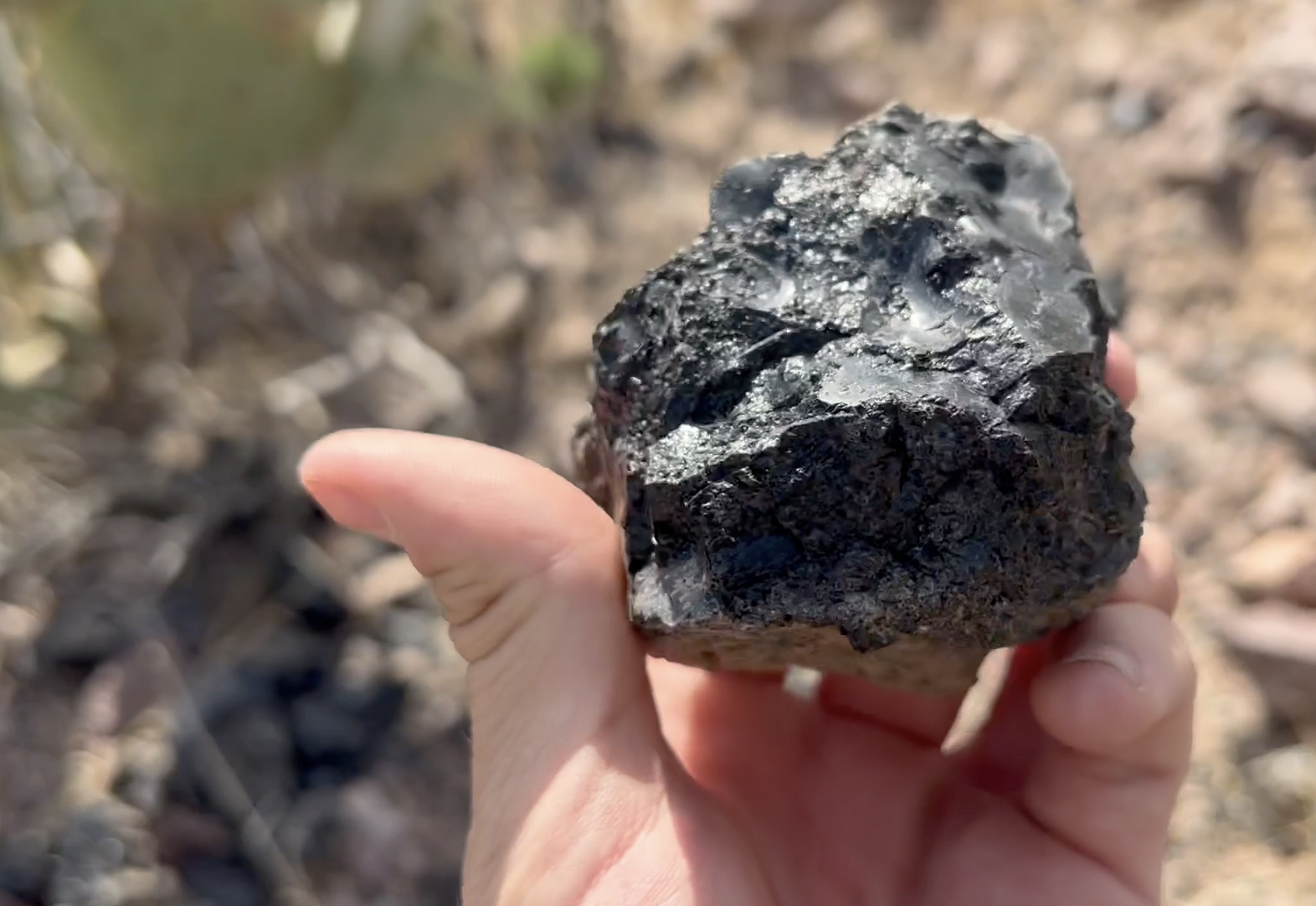 I believe this is black perlite, but initally thought it was obsidian.  The parking lot has a sign about the rocks found here.