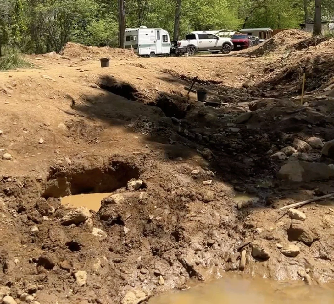 The digging area.  Prepare for mud if it's rained recently.