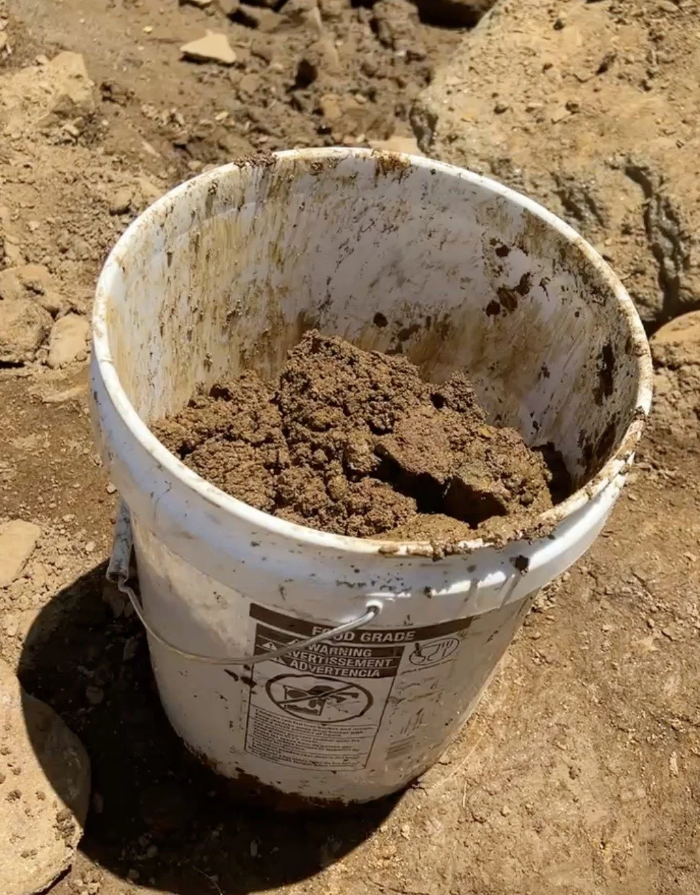 I filled 5-gallon buckets and shuffled them over to the flume line.  They get real heavy.