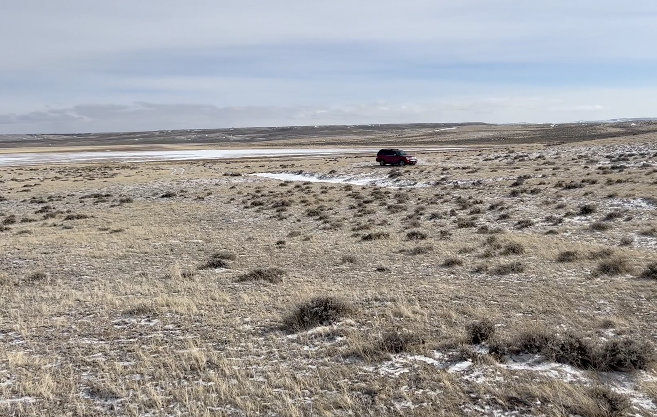 The ice patch behind my vehicle is what I believe is Carmody Lake itself.