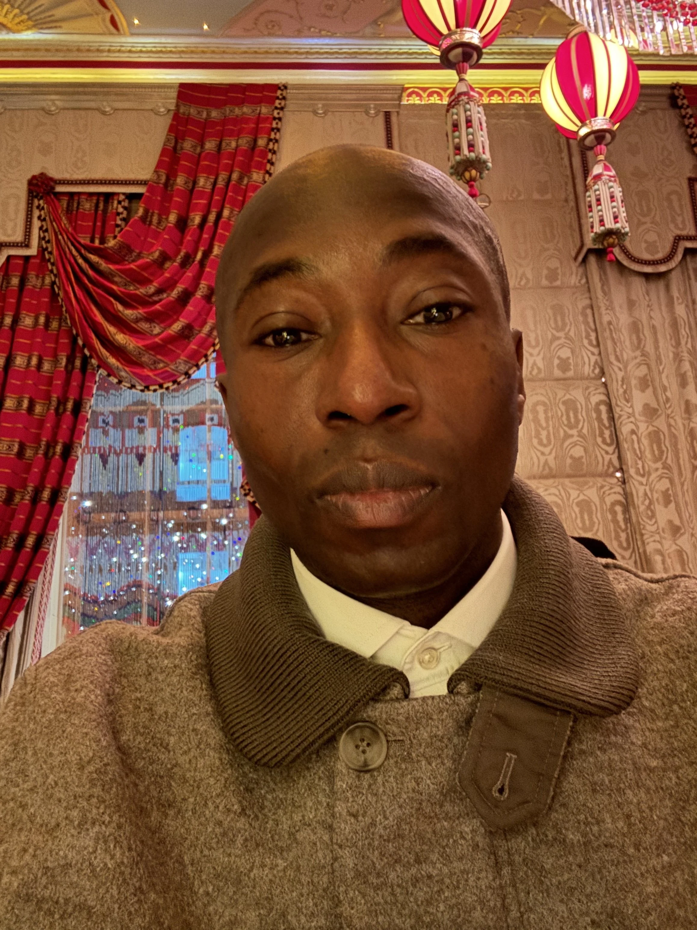 Mustafa Akindele wearing a cos jacket at Sketch Restaurant London