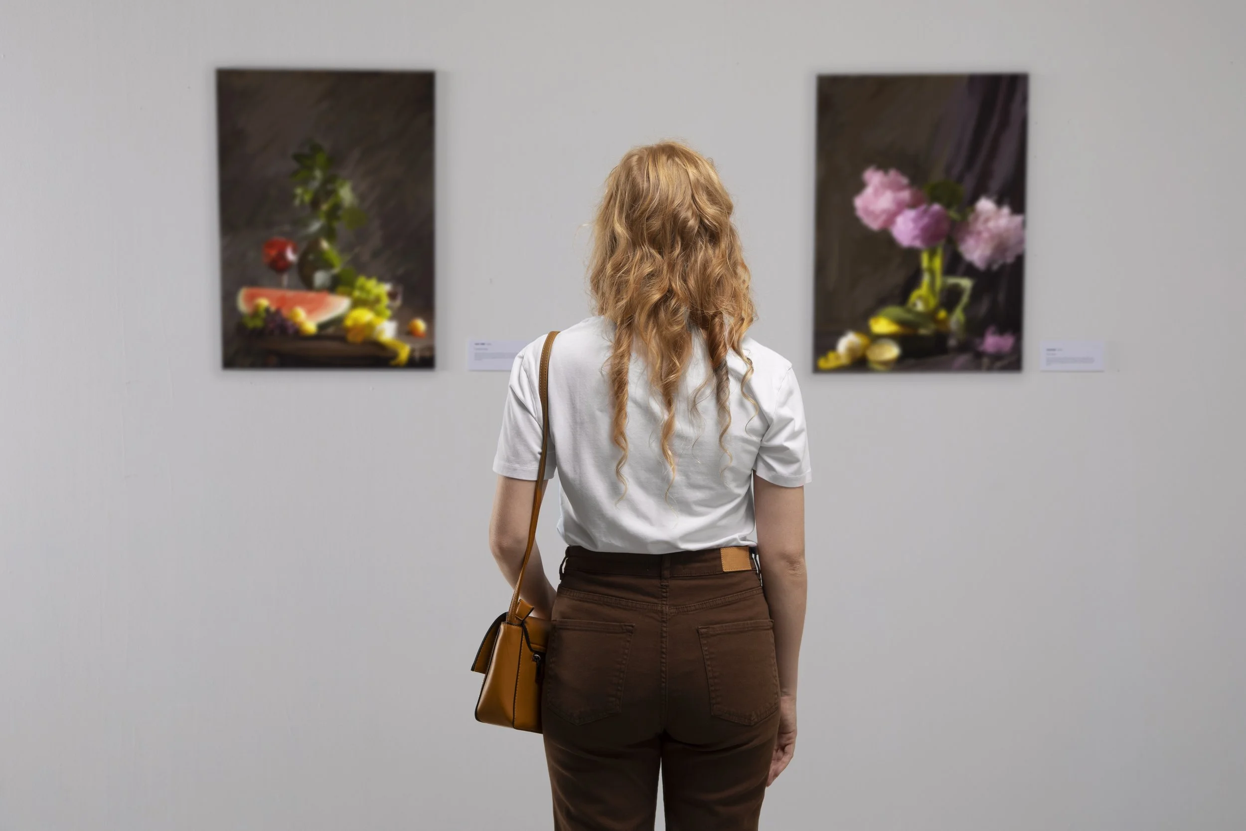 back-view-woman-looking-painting.jpg